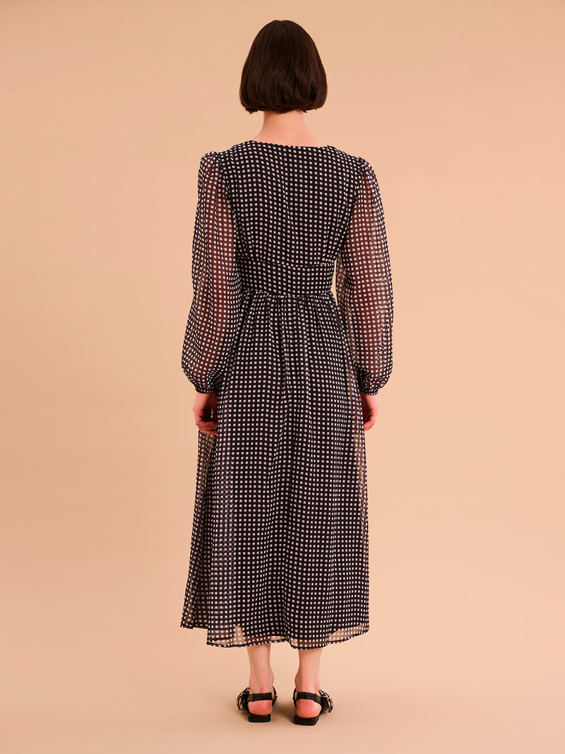 Long sleeved, v neck midi dress in black with white gingham print and ruching at the waist
