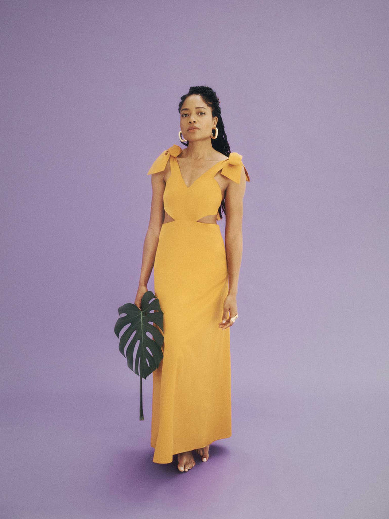 yellow maxi dress with cutout detailing and ties at the shoulder