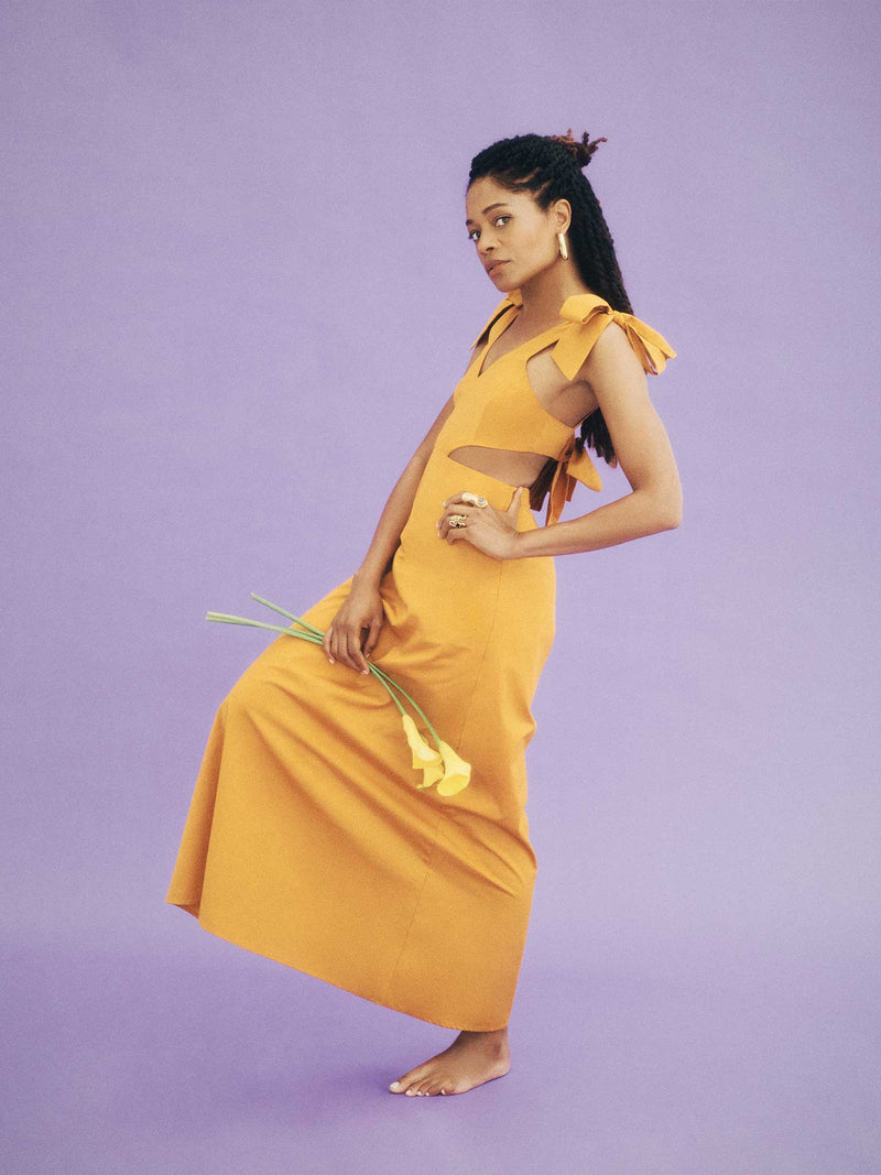 yellow maxi dress with cutout detailing and ties at the shoulder