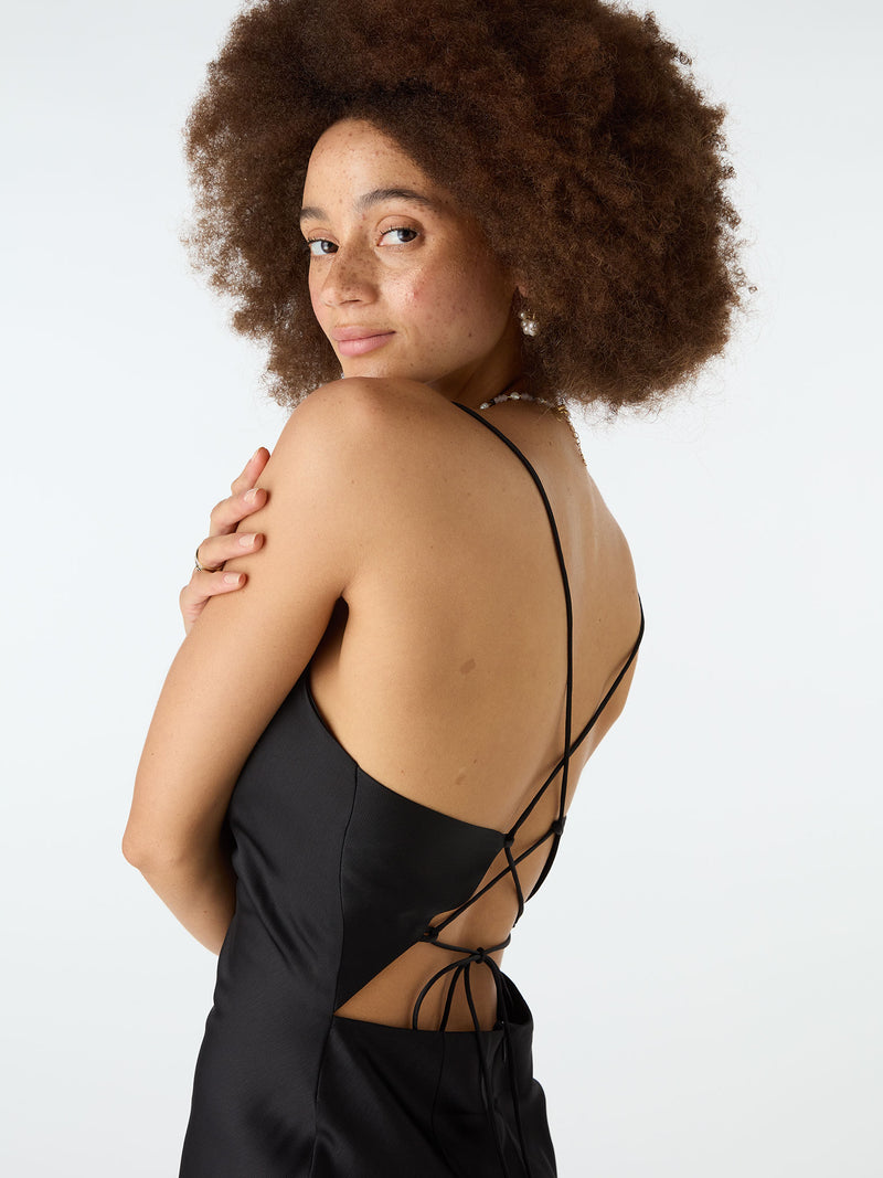 Black strappy mini dress with crossover tie back
