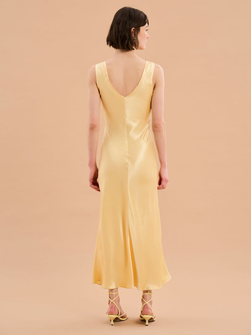 yellow satin maxi dress with v neck and ruching detail
